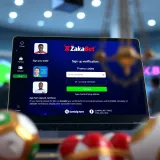 Exterior of a typical Zakabet shop in Nigeria with customers engaged in sports betting